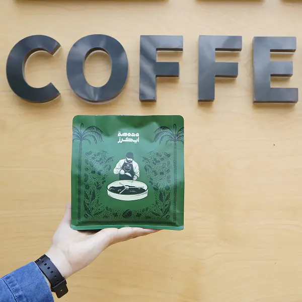Scatola del caffè stampata in verde con confezione speciale per caffè a goccia